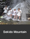 Ascetic monks training under a waterfall. Sekido Mountain, Nakanoto Town.  Summer Culture and Festivals